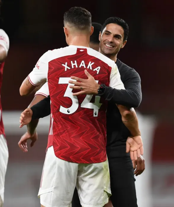 Framed Print : Arsenal's Victory: Mikel Arteta Embraces Granit Xhaka after Arsenal v West Ham United (2020-21) Framed Print : Arsenal's Victory: Mikel Arteta Embraces Granit Xhaka after Arsenal v West Ham United (2020-21)