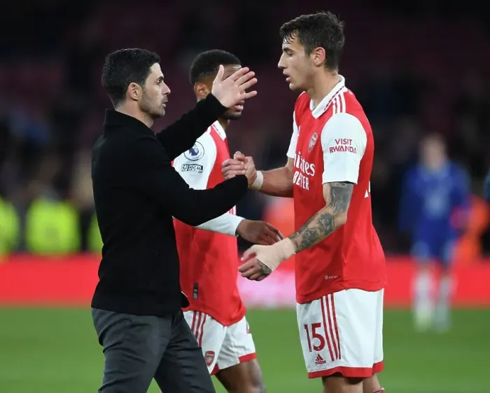Framed Print : Arsenal's Victory: Mikel Arteta Embraces Jakob Kiwior After Arsenal v Chelsea Match, Premier League 2022-23