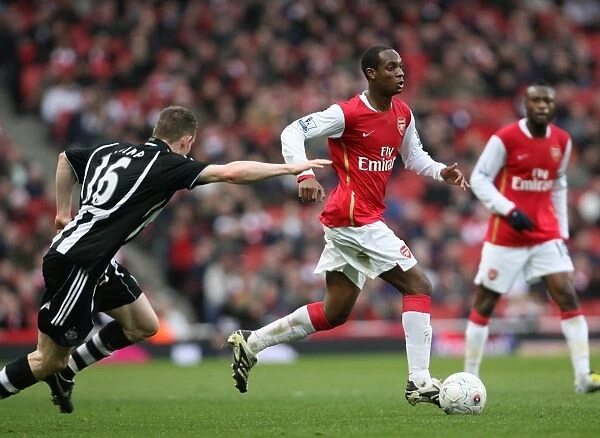 Arsenal's Victory Over Newcastle United: Justin Hoyte and James Milner Clash in the FA Cup Fourth Round, 2008