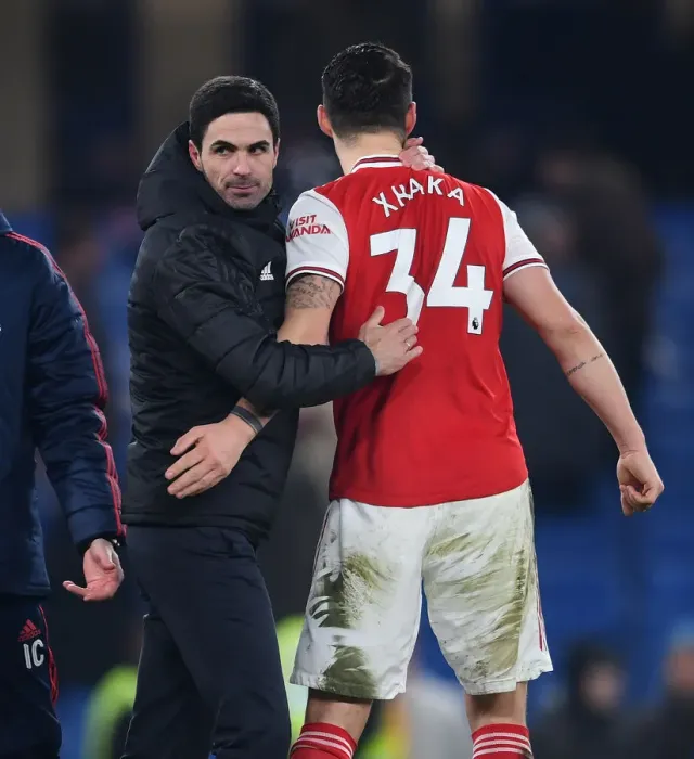 Framed Print : Arsenal's Victory at Stamford Bridge: Mikel Arteta Celebrates with Granit Xhaka