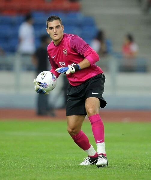 Arsenal's Vito Mannone in Action against Malaysia XI (2012)