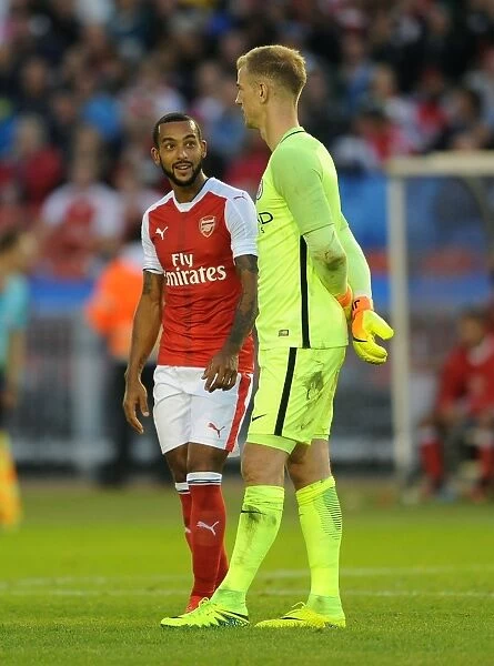 Arsenal's Walcott and Manchester City's Hart Engage in Deep Pre-Season Conversation