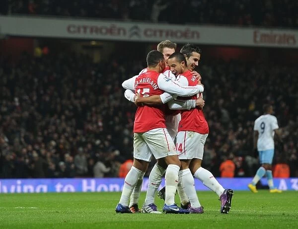Arsenal's Walcott, Oxlade-Chamberlain, Ramsey, and van Persie Celebrate Goals Against Aston Villa in FA Cup Fourth Round