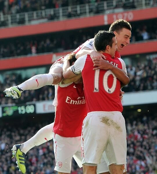 Arsenal's Walcott, van Persie, and Koscielny Celebrate Goals Against Tottenham (2011-12)