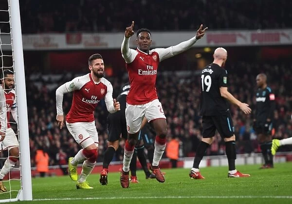 Arsenal's Welbeck and Giroud Celebrate Goal in Carabao Cup Quarters Against West Ham