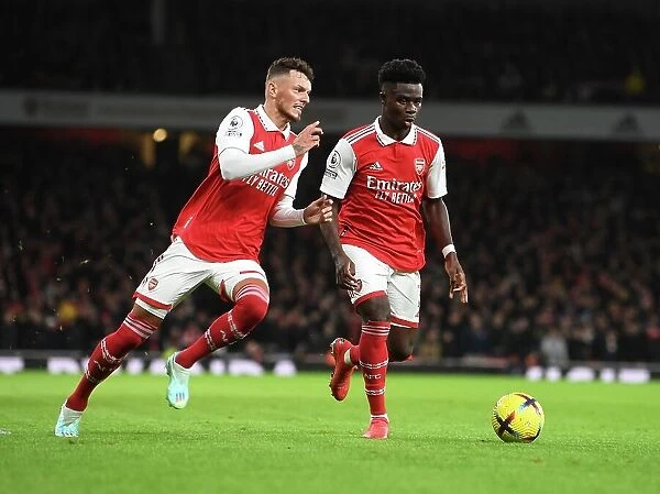 Arsenal's White and Saka in Action: A Premier League Battle - Arsenal vs Newcastle United, 2022-23