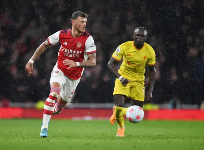 Framed Print : Arsenal's White Stands Firm Against Liverpool's Mane in Intense Premier League Clash