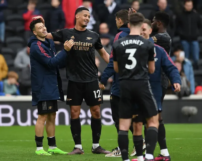 Framed Print : Arsenal's William Saliba and Gabriel Martinelli Celebrate Victory over Fulham in Premier League