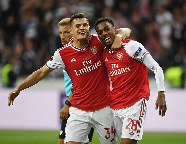 Arsenal's Willock and Xhaka Celebrate Goal in Europa League Clash vs Eintracht Frankfurt