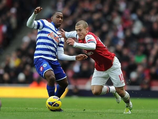 Arsenal's Wilshere Outsmarts Hoilett: Midfield Maestro Dazzles in Arsenal vs. QPR (2012-13 Premier League)