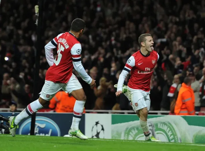 Framed Print : Arsenal's Wilshere and Oxlade-Chamberlain Celebrate First Goal in Champions League Match Against Montpellier (2012-13)
