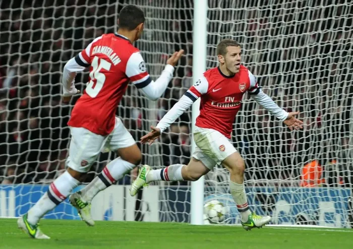Framed Print : Arsenal's Wilshere and Oxlade-Chamberlain Celebrate Goal Against Montpellier (2012-13)