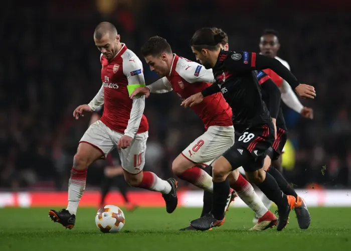 Framed Print : Arsenal's Wilshere and Ramsey Clash with Milan's Rodriguez in Europa League Showdown