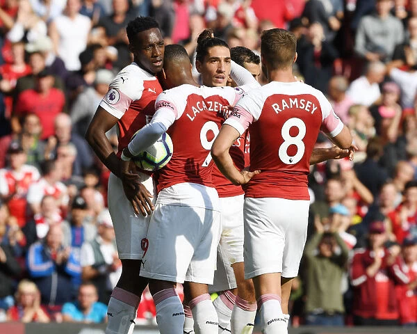 Arsenal's Winning Moment: Welbeck, Lacazette, Bellerin, and Ramsey Celebrate Goals Against West Ham United