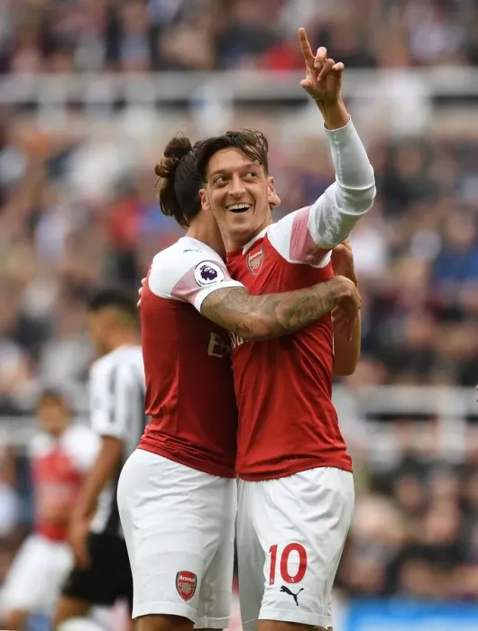 Framed Print : Arsenal's Winning Partnership: Ozil and Bellerin Celebrate Goals vs. Newcastle United Framed Print : Arsenal's Winning Partnership: Ozil and Bellerin Celebrate Goals vs. Newcastle United