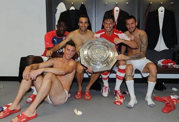 Arsenal's Winning Squad: Sanogo, Koscielny, Flamini, Giroud, Debuchy Celebrate FA Community Shield Victory over Manchester City
