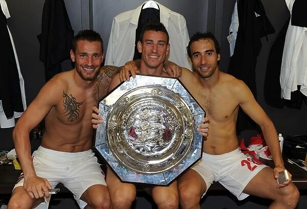 Arsenal's Winning Trio: Debuchy, Koscielny, and Flamini Celebrate FA Community Shield Victory