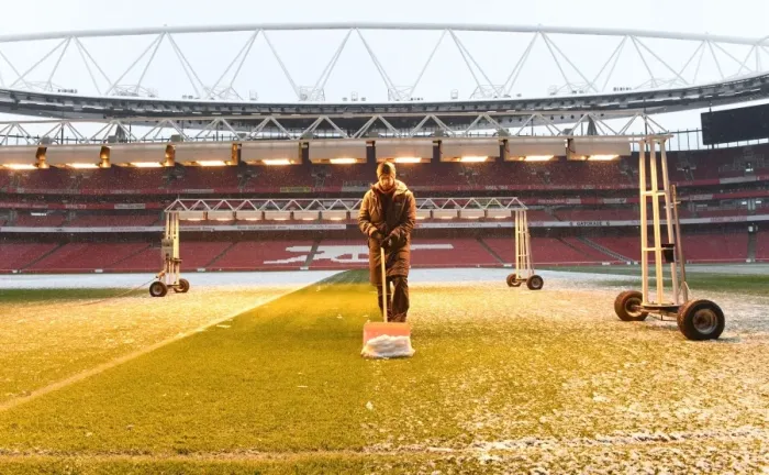 Framed Print : Arsenal's Winter Battle: Clearing the Pitch vs Manchester City Framed Print : Arsenal's Winter Battle: Clearing the Pitch vs Manchester City