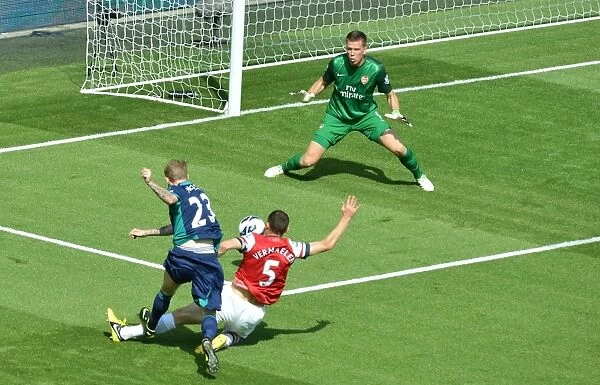 Arsenal's Wojciech Szczesny Saves from Sunderland's James McClean at Emirates Stadium