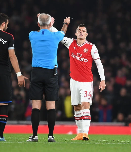Arsenal's Xhaka Clashes with Referee during Intense Arsenal vs. Crystal Palace Match