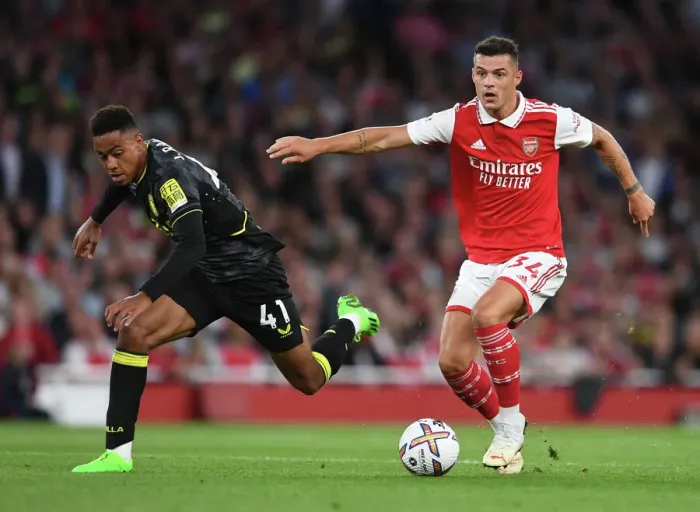 Framed Print : Arsenal's Xhaka Clashes with Villa's Ramsey in 2022-23 Premier League Showdown Framed Print : Arsenal's Xhaka Clashes with Villa's Ramsey in 2022-23 Premier League Showdown