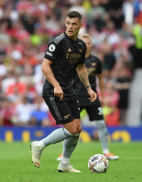 Framed Print : Arsenal's Xhaka Faces Off Against Manchester United at Old Trafford (2022-23 Premier League)