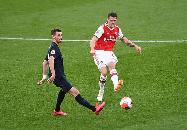 Arsenal's Xhaka Faces Off Against Schneiderlin Amidst Premier League Tension (Arsenal v Everton, 2019-20)