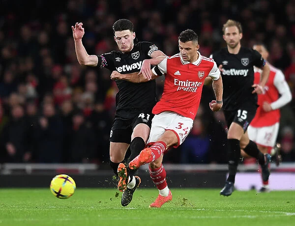 Arsenal's Xhaka Fends Off Rice Pressure in Premier League Clash (Arsenal v West Ham United 2022-23)