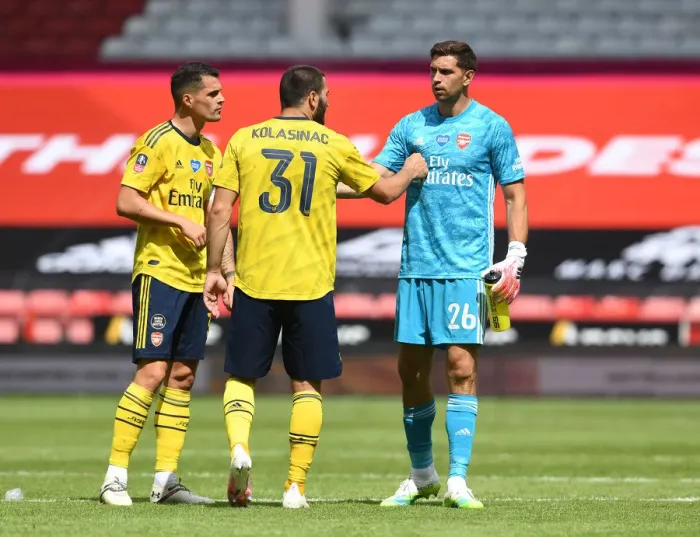 Framed Print : Arsenal's Xhaka, Kolasinac, and Martinez Celebrate FA Cup Quarterfinal Victory over Sheffield United