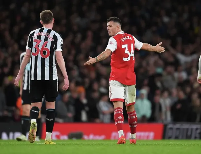 Framed Print : Arsenal's Xhaka and Longstaff in Deep Conversation During Arsenal v Newcastle Premier League Clash (2022-23)