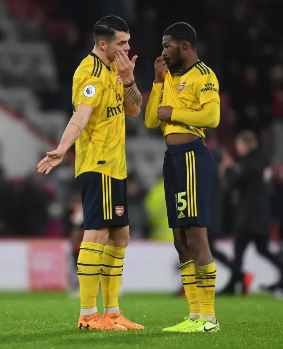 Framed Print : Arsenal's Xhaka and Maitland-Niles Share a Moment after AFC Bournemouth Clash (Premier League 2019-20)