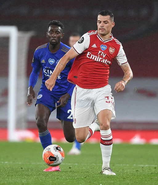 Arsenal's Xhaka Outmaneuvers Leicester's Ndidi in Premier League Clash