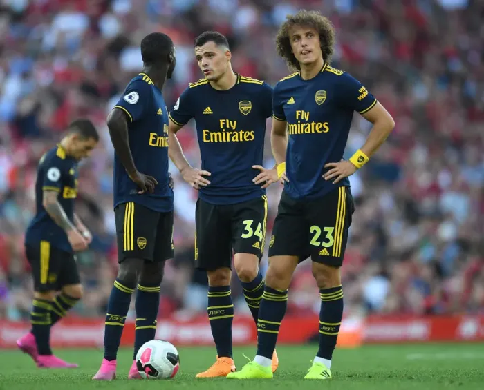 Framed Print : Arsenal's Xhaka, Pepe, and Luiz Face Off Against Liverpool in Premier League Clash