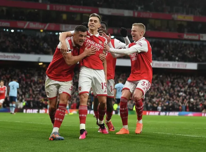 Framed Print : Arsenal's Xhaka, Zinchenko, and Trossard Celebrate Goal Against Brentford (2022-23)