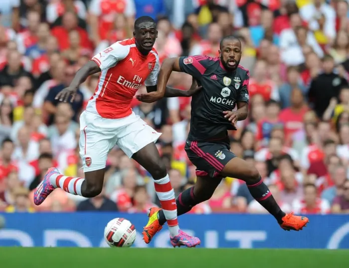 Framed Print : Arsenal's Yaya Sanogo Battles Past Benfica's Eliseu in 2014-15 Emirates Cup Clash Framed Print : Arsenal's Yaya Sanogo Battles Past Benfica's Eliseu in 2014-15 Emirates Cup Clash