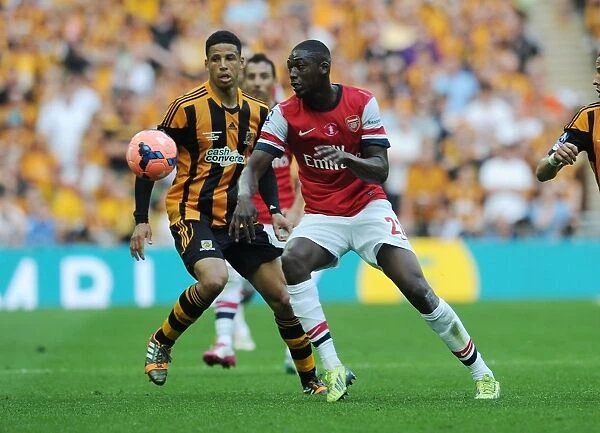 Arsenal's Yaya Sanogo Breaks Past Hull's Curtis Davies in FA Cup Final Showdown