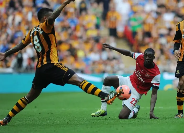 Framed Print : Arsenal's Yaya Sanogo Clashes with Hull's Tom Huddlestone in FA Cup Final Showdown