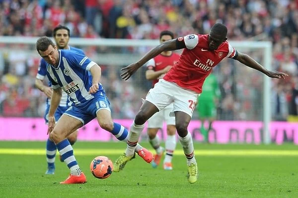 Arsenal's Yaya Sanogo vs. Wigan's James McArthur: A FA Cup Semi-Final Battle
