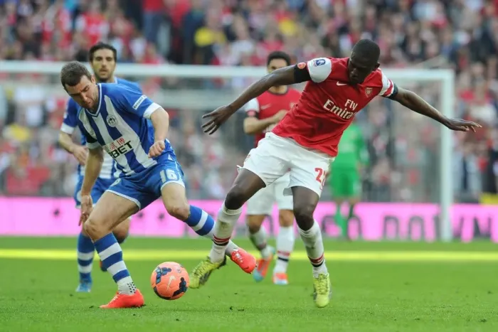 Framed Print : Arsenal's Yaya Sanogo vs. Wigan's James McArthur: A FA Cup Semi-Final Battle Framed Print : Arsenal's Yaya Sanogo vs. Wigan's James McArthur: A FA Cup Semi-Final Battle