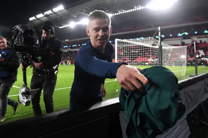 Framed Print : Arsenal's Zinchenko Delights Fan with Shirt Gift After Champions League Victory