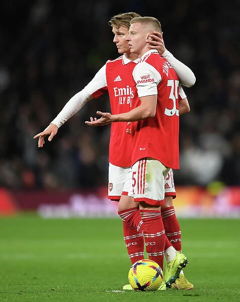 Arsenal's Zinchenko and Odegaard in Action against Tottenham in Premier League Clash (2022-23)