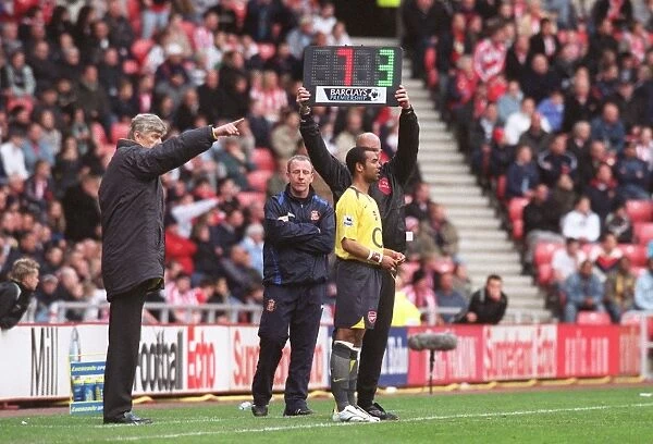 Arsene Wenger the Arsenal Manager brings on substitute Ashley Cole (Arsenal)