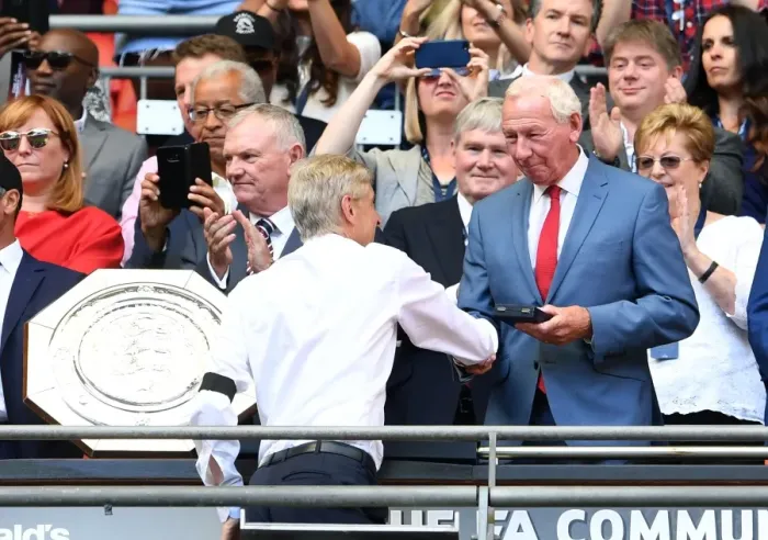 Framed Print : Arsene Wenger the Arsenal Manager is handed his medal by Bob Wilson the former Arsenal Framed Print : Arsene Wenger the Arsenal Manager is handed his medal by Bob Wilson the former Arsenal