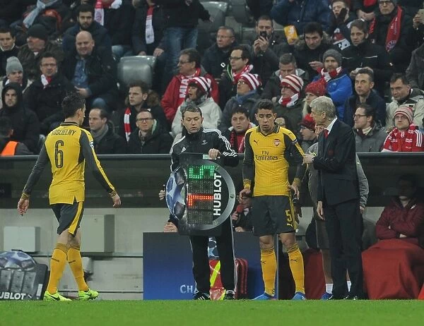 Arsene Wenger the Arsenal Manager oversees the substitution of Laurent Koscielny