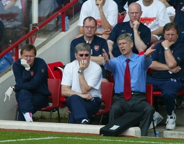 Arsene Wenger the Arsenal manager and Pat Rice his assistant