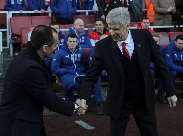 Arsene Wenger the Arsenal Manager shakes hands with Roberto Martinez of Everton. Arsenal 2