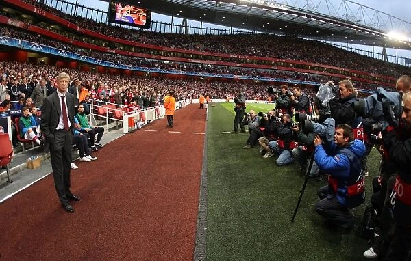 Arsene Wenger the Arsenal Manager stands infront of the photographers