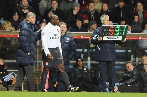 Arsene Wenger the Arsenal Manager with sub Sol Campbell (Arsenal). Aston Villa 0