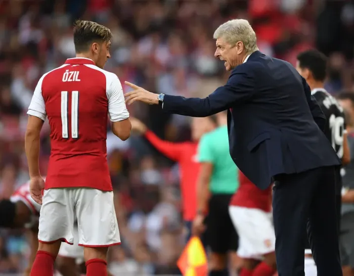 Framed Print : Arsene Wenger Conferring with Mesut Ozil during Arsenal's Emirates Cup Match against Sevilla, 2017 Framed Print : Arsene Wenger Conferring with Mesut Ozil during Arsenal's Emirates Cup Match against Sevilla, 2017