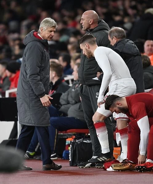 Arsene Wenger Consults Aaron Ramsey during Tense Arsenal-Chelsea Carabao Cup Showdown